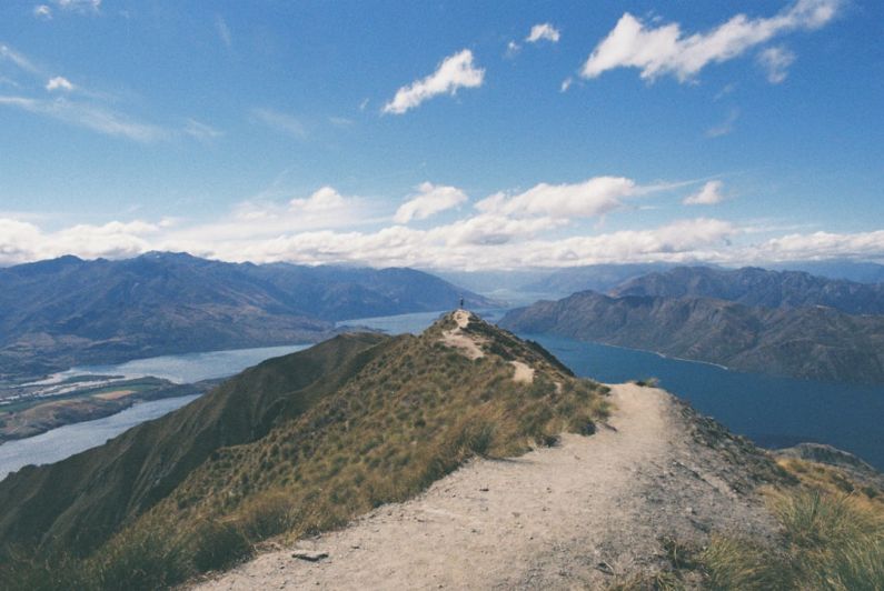 New Zealand Budget - photography of mountain near body of water